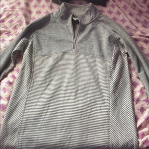 a grey/silver/white zip up sweater